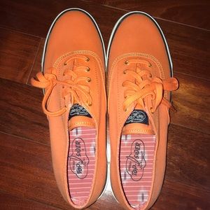 Orange Sperry top sider tennis shoes